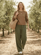 Two women wearing breathable cotton and linen casual chic duo two-piece sets standing outdoors