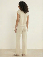 First Class Travel two-piece set in soft viscose-acrylic fabric with pleated wide-leg pants and matching top for wrinkle-resistant comfort and stylish travel wear
