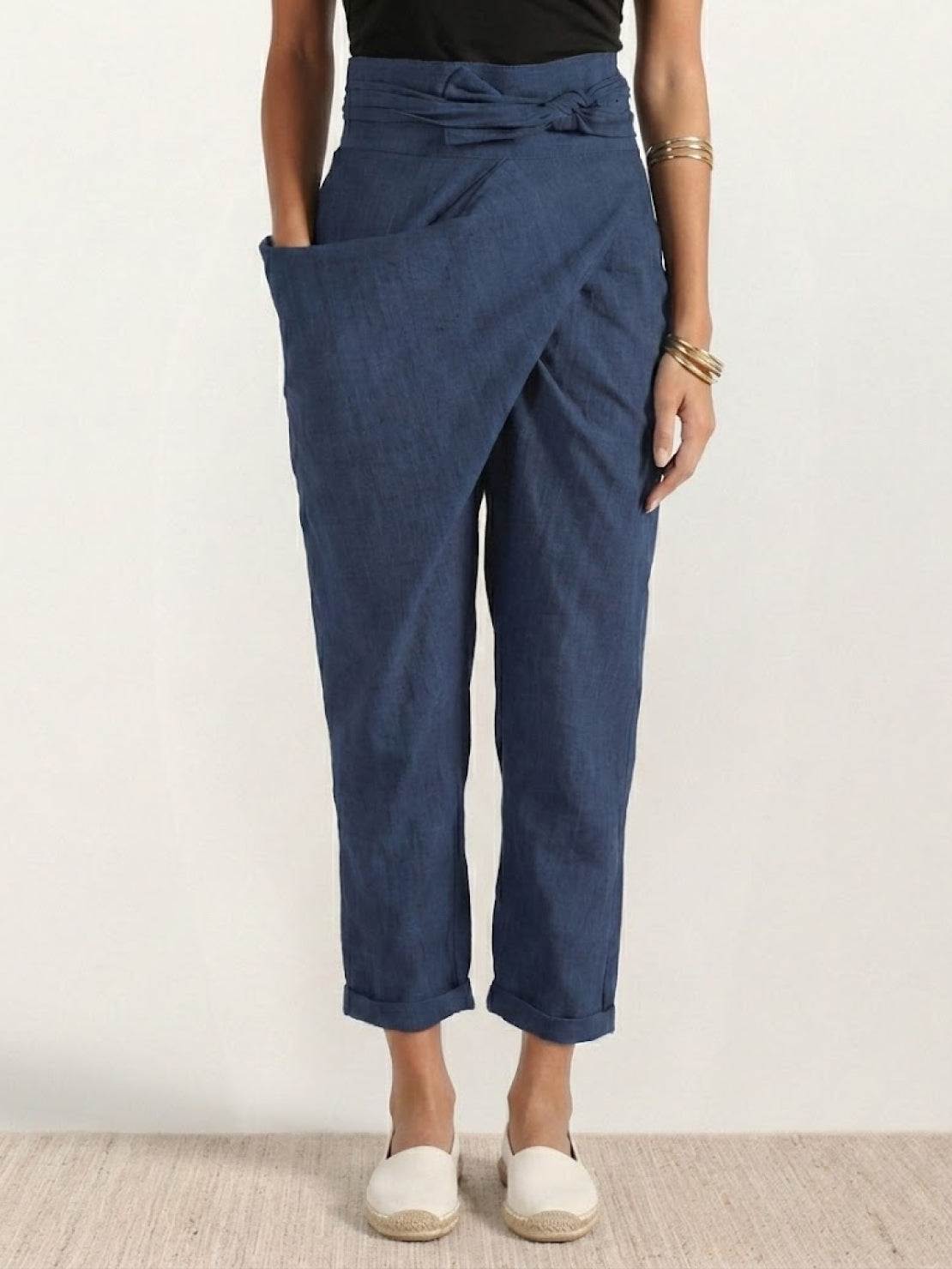Woman wearing high-waist wrapped pants with loose fit and breathable stretch fabric