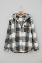 Highland Plaid Shacket with soft fleece lining, attached hood, button-front, and front pocket in gray and white plaid pattern.
