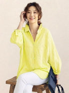 Oversized linen shirt in breathable cotton-linen blend with relaxed fit and back button details