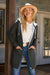 woman wearing oversized long zip sweatshirt hoodie with drawstring hood and front pockets outdoors