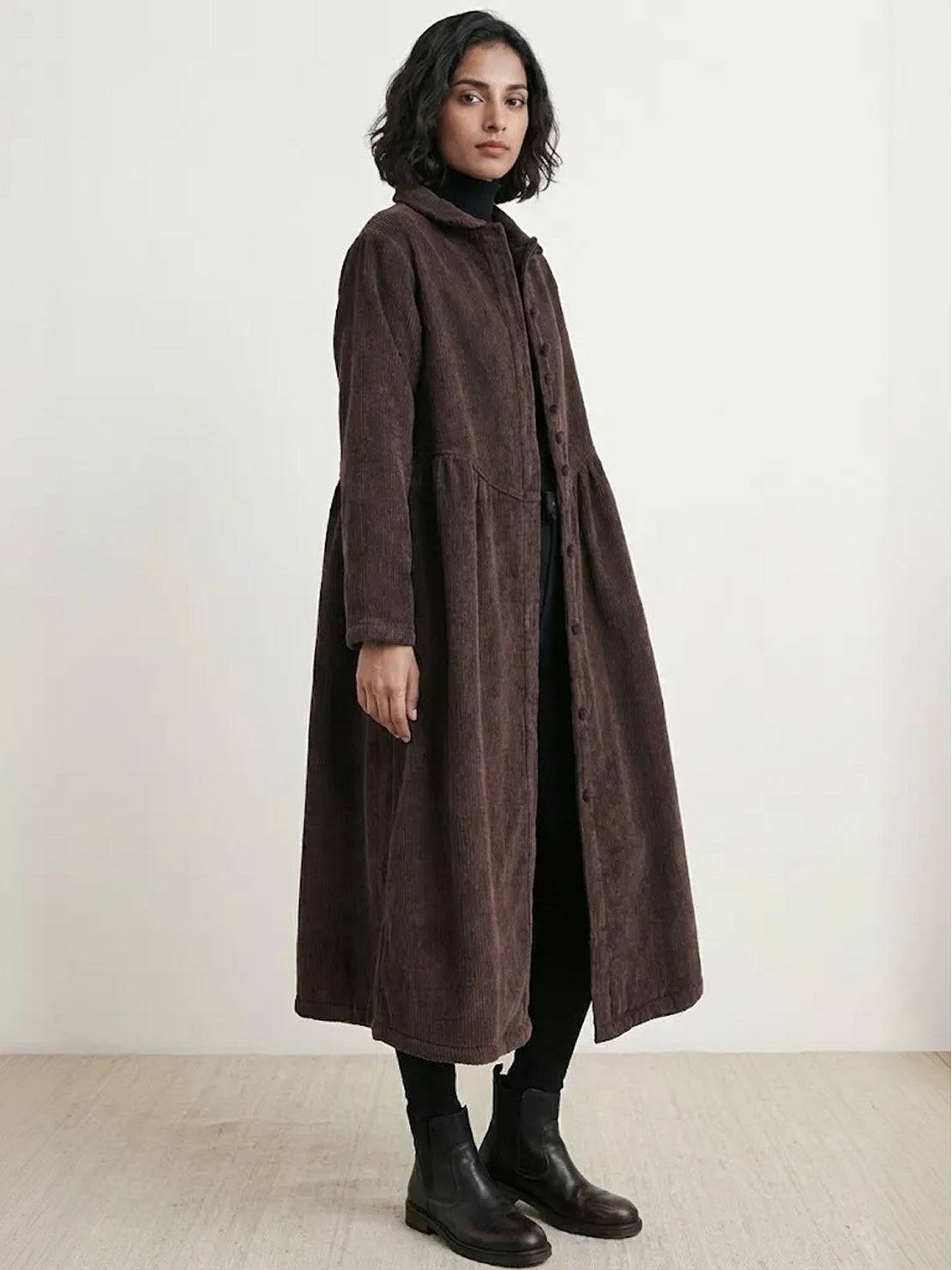Oversized vintage corduroy coat in warm earth tones with thick texture and classic fit