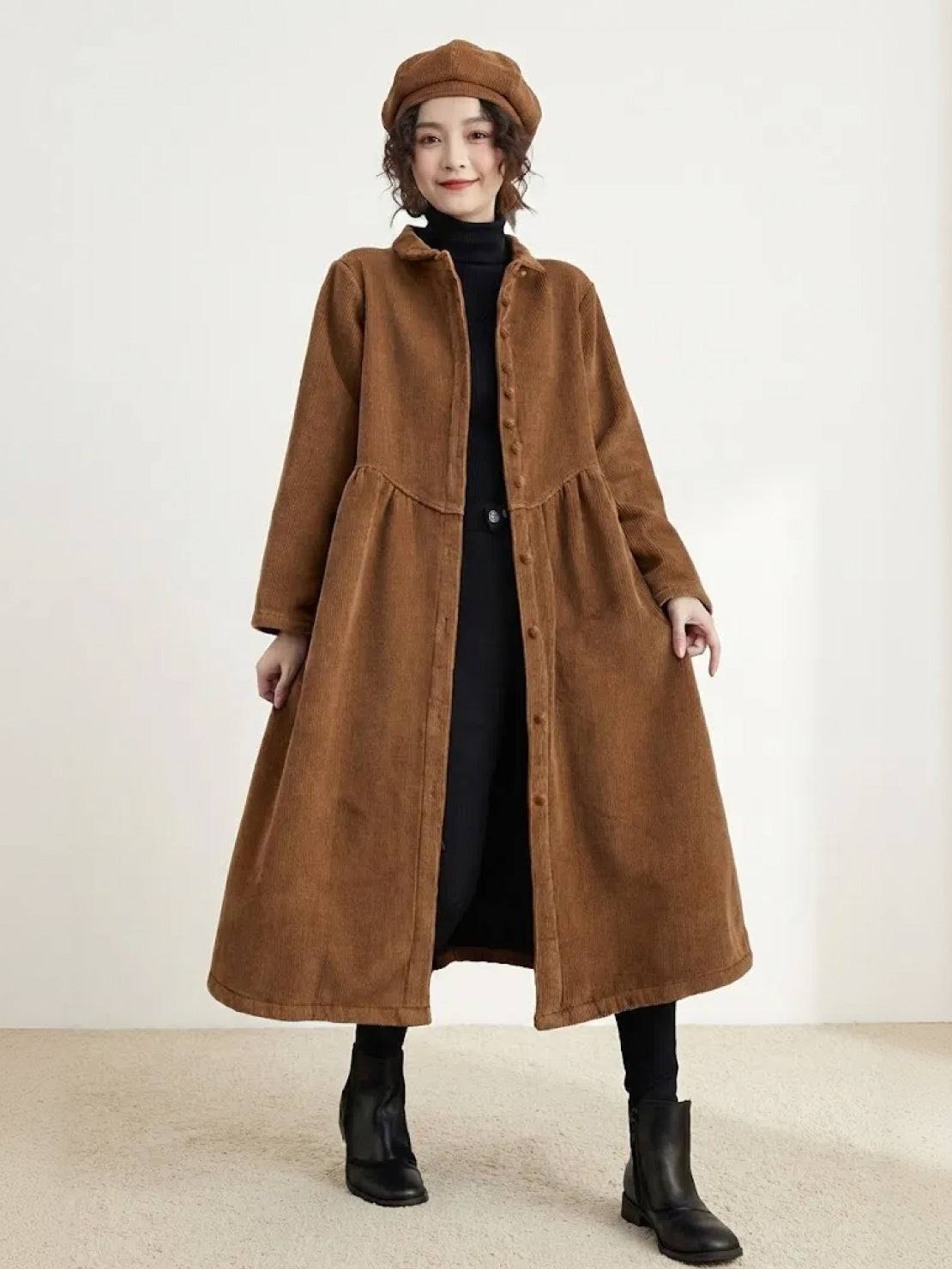 Oversized vintage corduroy coat in warm earth tones with thick texture and deep pockets for winter layering
