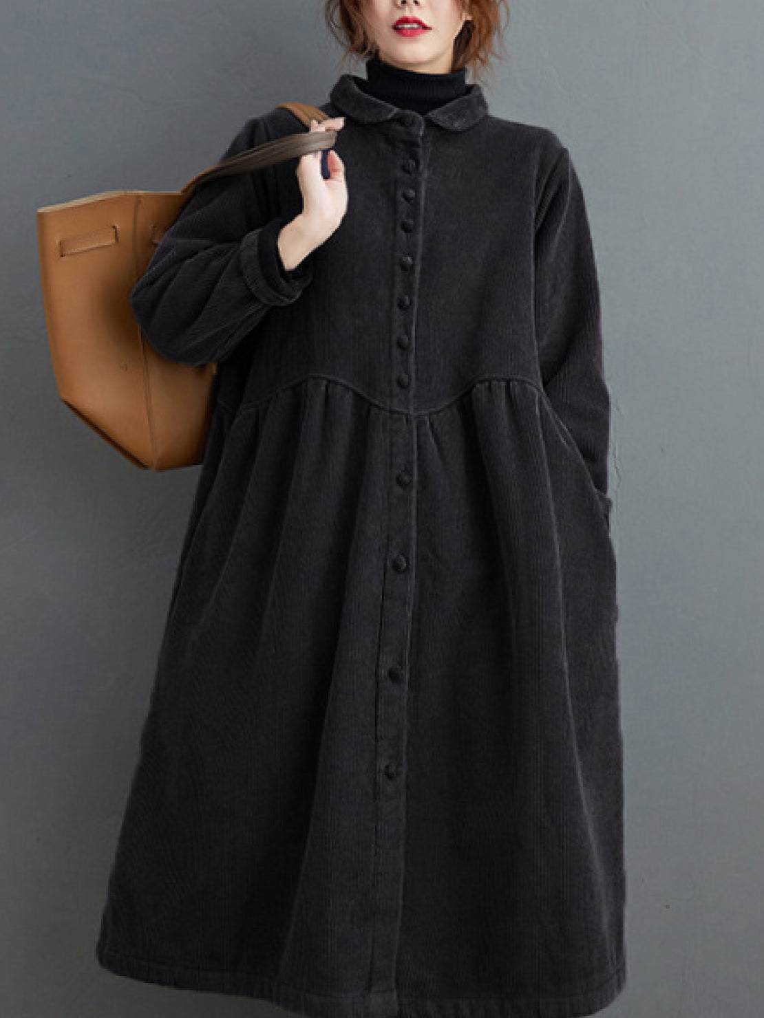 Oversized vintage corduroy coat in warm earth tones with thick texture and deep pockets for winter layering