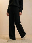 Black wide-leg pants from Plush & Preppy Camel Two-Piece Set styled with casual sneakers