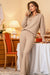 Woman wearing plush and preppy camel two-piece set with polo collar in cozy indoor setting