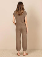 Woman wearing comfy couture knit sweater two-piece set in soft neutral tones