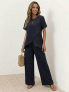 Two-piece textured elegance set with asymmetrical top and wide-leg pants in soft stretch fabric