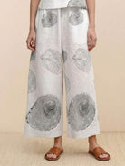 Wide-leg loose fit co-ord set trousers with large circular abstract prints and elastic waistband.