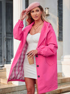 Woman wearing pink oversized Rain Couture Windbreaker with checked lining and white dress outdoors