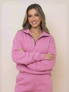 woman wearing pink ultra-soft and comfy co-ord tracksuit set with half zip and relaxed fit