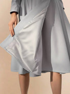 Water-repellent A-line hooded raincoat for women with insulated lining and feminine fit