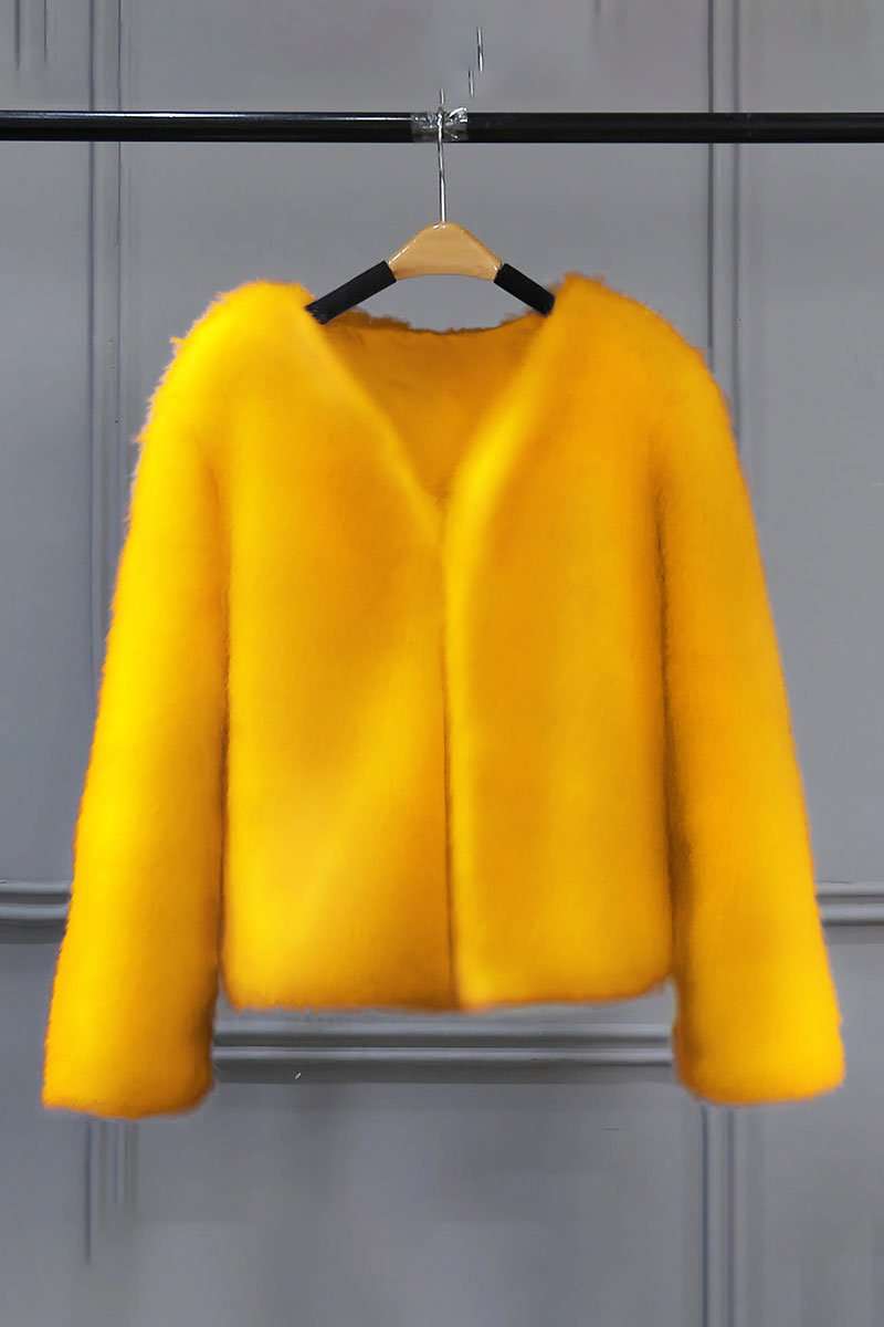 Bright yellow bold faux fur jacket with V neckline and button front closure on a hanger